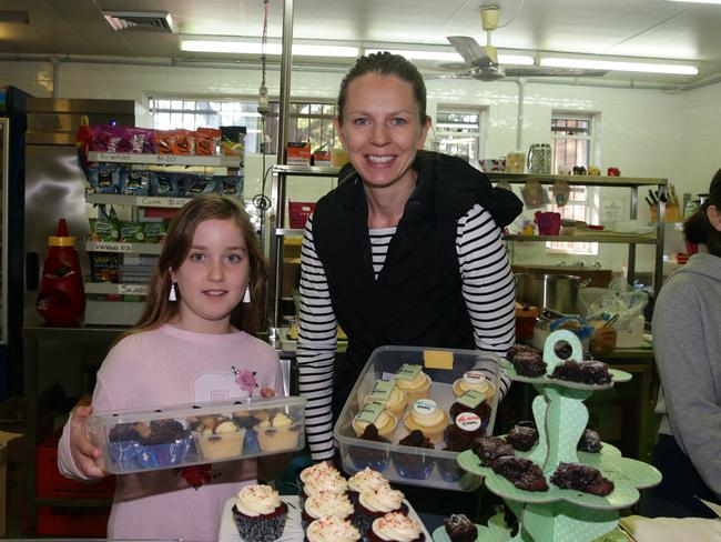 Zoe Keyes and Sonja Parsons at the cake stall at Strathfield Public School. Picture: AAP IMAGE / Craig Wilson