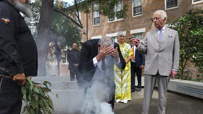 King Charles III takes part in a smoking ceremony during a visit to the National Centre for Indigenous Excellence. Picture: Newswire