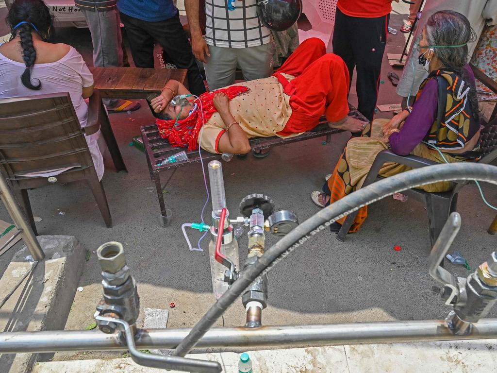 Patients breathe with the help of oxygen provided by a Gurdwara, a place of worship for Sikhs, under a tent installed along the roadside in Ghaziabad, a city in the Indian state of Uttar Pradesh. Picture: Prakash Singh