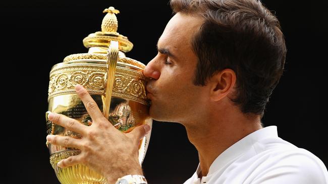 Roger Federer with his 2017 Wimbledon trophy. Photo: Clive Brunskill/Getty Images