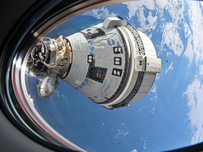 Boeing’s Starliner spacecraft is pictured docked to the Harmony moduleiss071e265073_stk (July 3, 2024) --- Boeing's Starliner spacecraft that launched NASA's Crew Flight Test astronauts Butch Wilmore and Suni Williams to the International Space Station is pictured docked to the Harmony module's forward port. This view is from a window on the SpaceX Dragon Endeavour spacecraft docked to the port adjacent to the Starliner.Image Credit: NASA