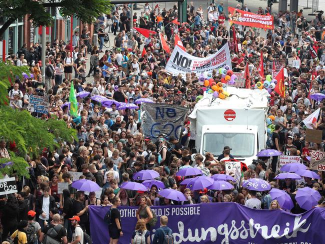 A rally near a concert hall where the leaders will head after the meeting for a concert. Picture: AFP PHOTO / Ronny HARTMANN