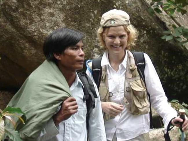 Annette Herfkens with Mr Cao, the first person to spot her after the crash. Picture: Provided by publisher
