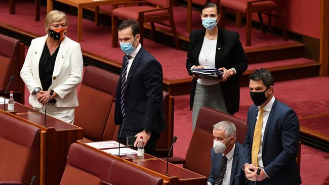 Nationals Senators Matt Canavan and Sam McMahon, Liberal Senators Concetta Fierravanti-Wells, Gerard Rennick and Alex Antic after voting for One Nation leader Senator Pauline Hanson’s vaccine discrimination bill on Monday. Picture: Mick Tsikas/AAP