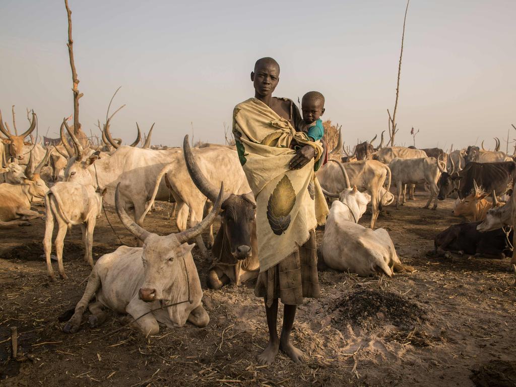 South Sudanese cattle herder Mary Amer, 22, with her child in a camp in Mingkaman, South Sudan, on March 3, 2018. Picture: AFP