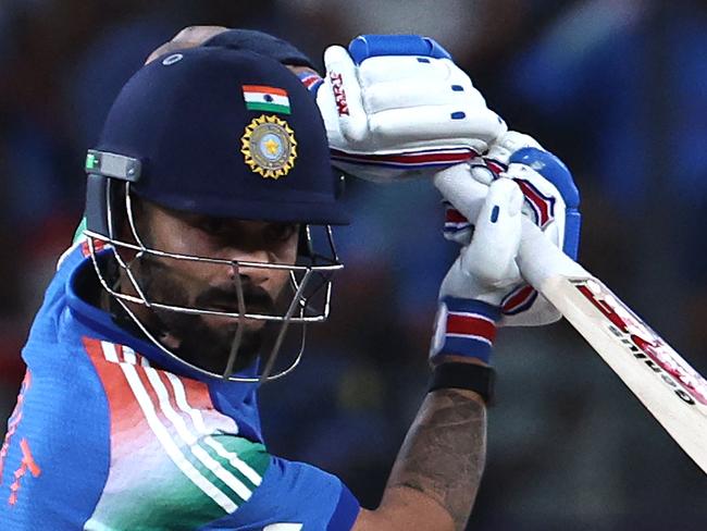 India's Virat Kohli watches the ball after playing a shot during the ICC Champions Trophy one-day international (ODI) semi-final cricket match between Australia and India at the Dubai International Stadium in Dubai on March 4, 2025. (Photo by FADEL SENNA / AFP)