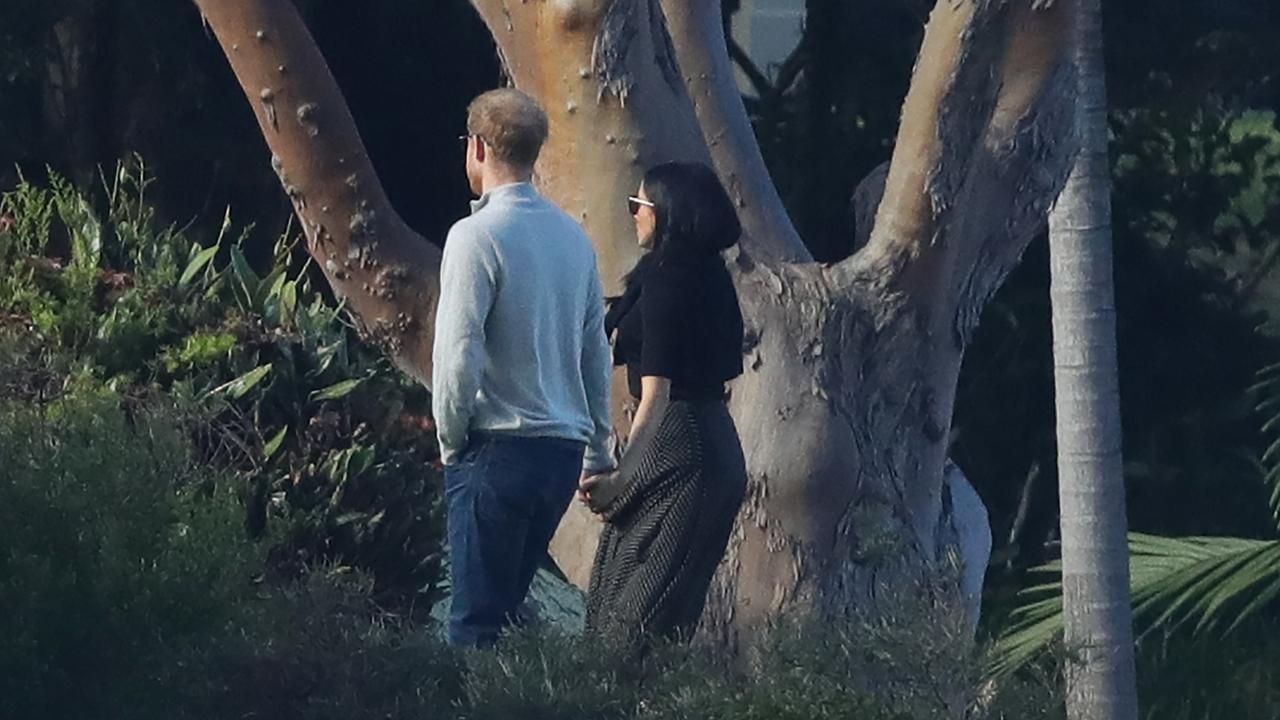 Harry and Meghan take a stroll through the grounds of Admiralty House in Sydney. Picture: www.matrixpictures.com.au