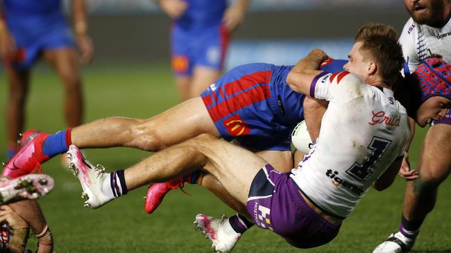 Ryan Papenhuyzen denied Kalyn Ponga with a trysaving tackle. Picture: Darren Pateman/AAP