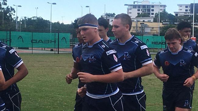 Redcliffe SHS hooker Jack Cameron leaves the field at halftime with teammates.