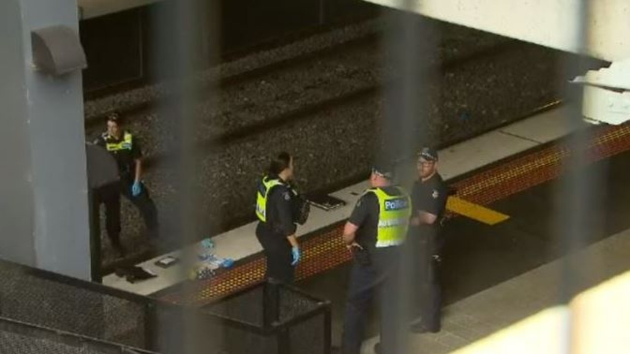 Police on the scene where the 56 year old was struck by a train. Picture: 9 News