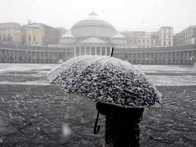 A person walks in front of the San Francesco di Paola Basilica during a snowfall in Naples, Italy, Tuesday, Feb. 27, 2018. The Arctic storm dubbed the “Beast from the East” saw temperatures across much of Europe fall Monday and Tuesday to their lowest level this winter, and even brought a rare a snowstorm to Rome on Monday, and is spreading to other parts of Italy. Picture: AP