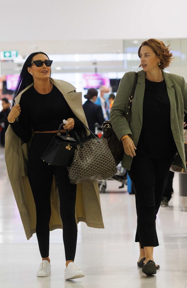 There were rumours that shoe designer and WAG Terry Biviano (left) had left production mid-season, but she was pictured en route to Tokyo on Sunday. Picture: NCA NewsWire/ David Swift.