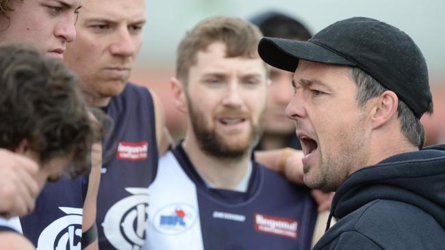 Melton Centrals coach Brian Wheelahan addreses his players during Sunday’s match against Rockbank. Photo: Dennis Manktelow