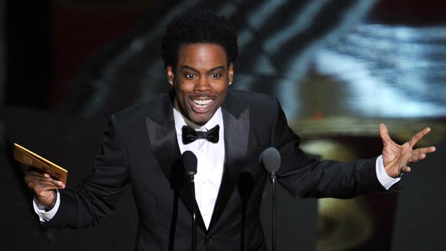 Chris Rock speaks onstage during the 84th Annual Academy Awards in 2012.