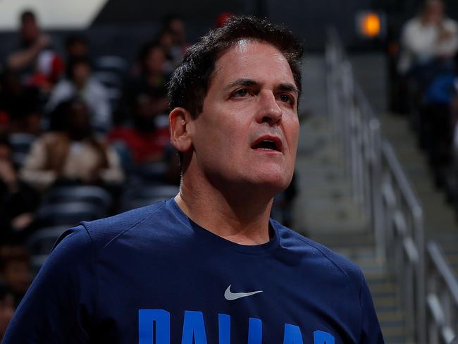 (FILES) In this file photo taken on December 22, 2017 Mark Cuban, owner of the Dallas Mavericks, reacts during the game against the Atlanta Hawks at Philips Arena in Atlanta, Georgia. NOTE TO USER: User expressly acknowledges and agrees that, by downloading and or using this photograph, User is consenting to the terms and conditions of the Getty Images License Agreement. - The NBA fined Dallas Mavericks owner Mark Cuban $500,000 on March 6, 2020 for a Twitter tirade ripping league referees and commissioner Adam Silver denied the club's protest of a February 22 loss in Atlanta. Cuban, a billionaire businessman who bought the Mavericks in 2000, was slammed with the hefty fine for his criticism and conduct detrimental to NBA officiating, also described in a league statement as an "effort to influence refereeing decisions during and after a game." (Photo by Kevin C. Cox / GETTY IMAGES NORTH AMERICA / AFP)