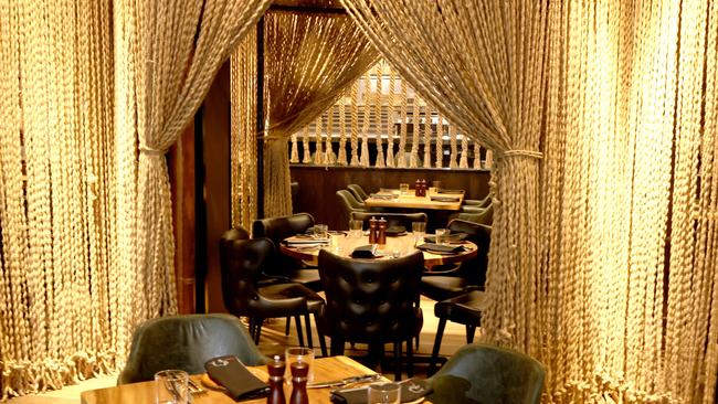The interior design features four semi-private dining spaces surrounded by hanging ropes, inspired by the African “boma”. Picture: NCA NewsWire / Kelly Barnes