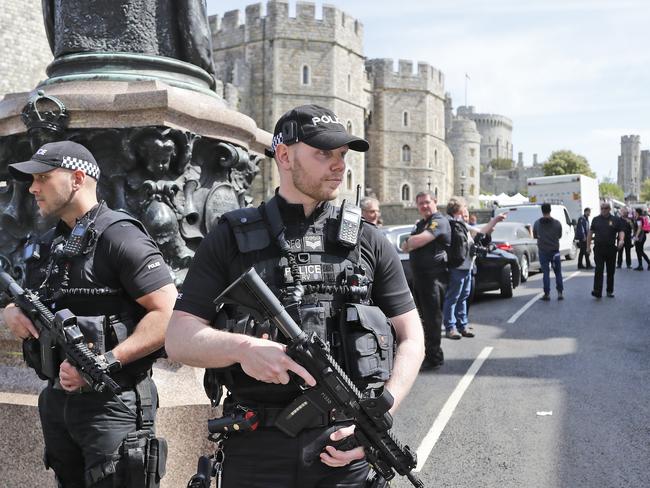 Armed police patrol Windsor as preparations ahead of the wedding of Prince Harry and Meghan Markle tomorrow. Picture: AP Photo/Frank Augstein