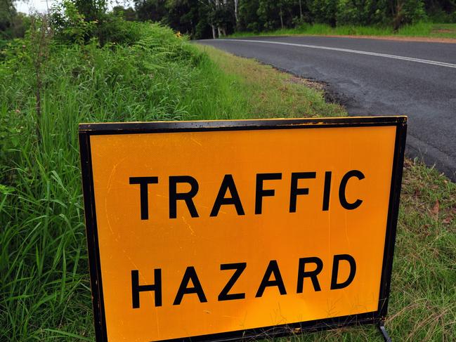 Land slip in Duke Road Doonan poses a hazard to motorists.Traffic Hazard signPhoto Geoff Potter / Noosa News.