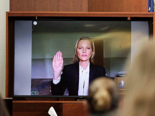 Model Kate Moss is sworn in via video link at the Fairfax County Circuit Courthouse in Fairfax, Virginia, on May 25, 2022. Picture: Evelyn Hockstein / AFP.