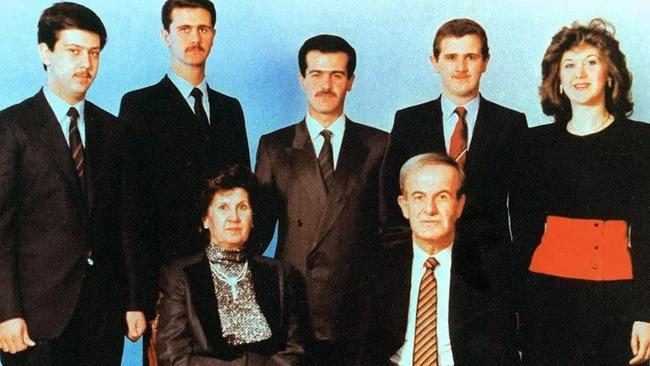 Syria's late president Hafez al-Assad pictured in 1985 with his wife Anissah Makhlouf (seated) and, behind them, from right, their five children: Bushra, the late Majd, the late Bassel, deposed president Bashar, and the youngest son, Maher. Picture: Files/AFP