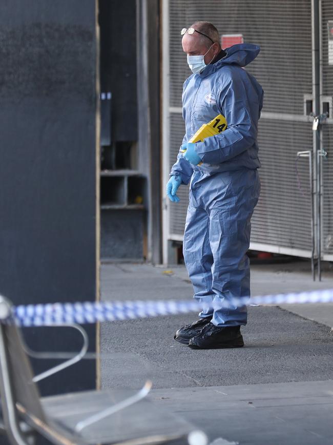 Forensics gather evidence near Flinders St. Picture: AAP Image/David Crosling