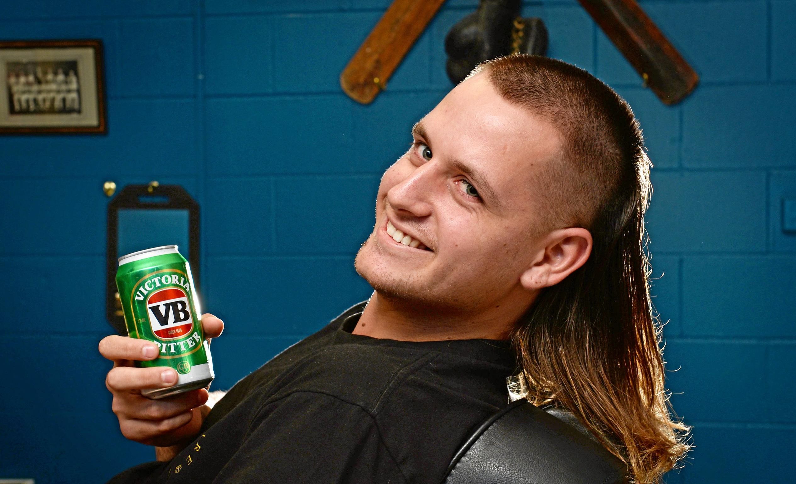 The Mullet is making a comeback in Mackay. Jai Gurr getting his Mullet styled by Andrew Folwell at Gold Empire Tattoo and Hair in Mackay. Picture: Stuart Quinn