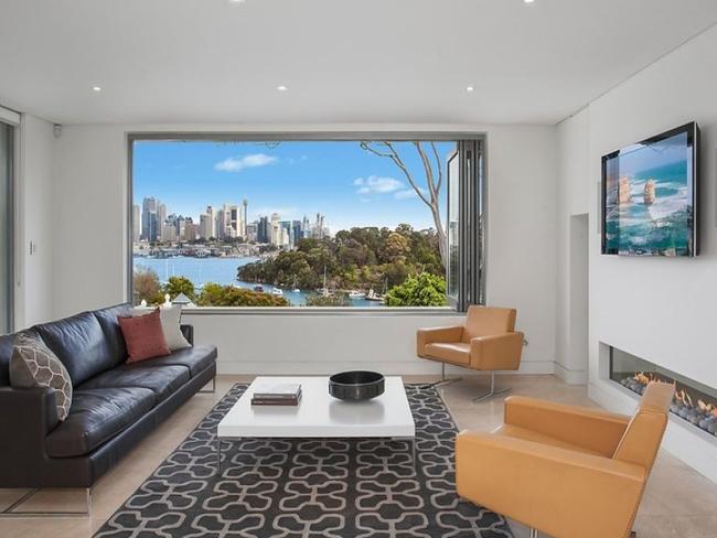 The property has sweeping views of the harbour and city skyline.
