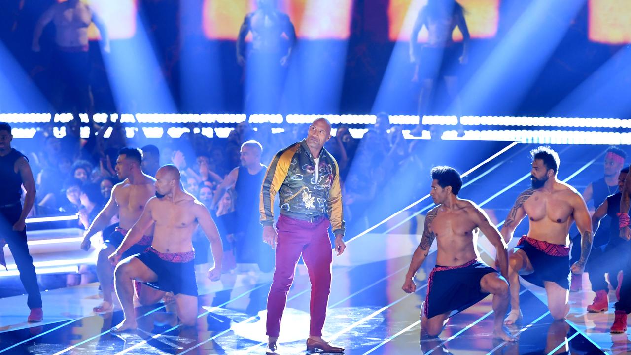 Dwayne Johnson performs onstage during the 2019 MTV Movie and TV Awards.