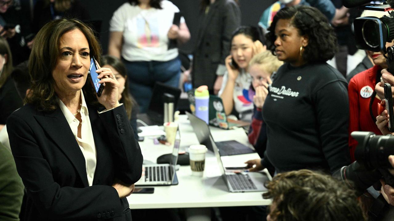 In this photo, the phone screen shows Ms Harris is on a call. Picture: Brendan Smialowski / AFP