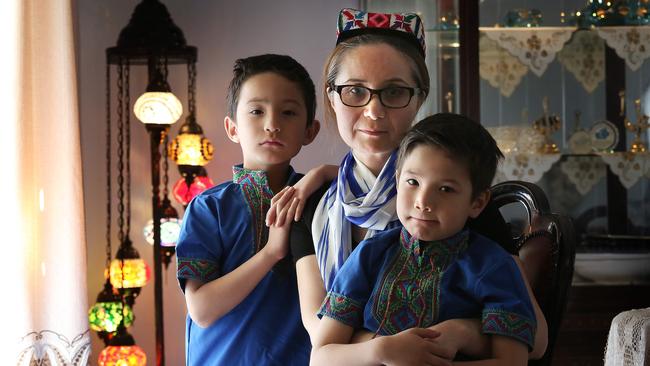 Zulfia Erk with her children Kutyar, 8, left, and Umit, 5, at their home in Casula, Sydney. Picture: James Croucher