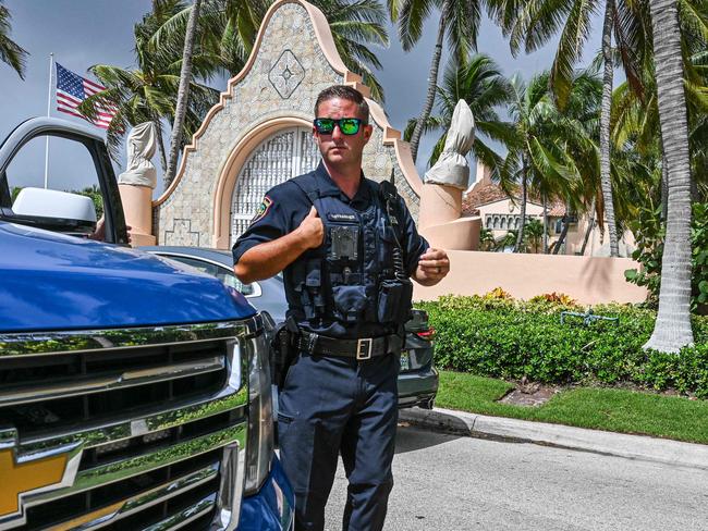 Local law enforcement officers are seen in front of the home of former President Donald Trump at Mar-a-Lago in Palm Beach, Florida. The raid was a game changer, say analysts. Picture: AFP