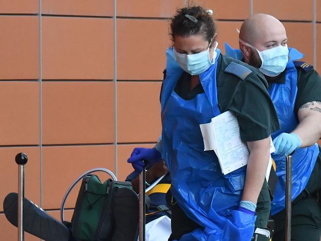 Paramedics wheel a patient into The Royal London Hospital in East London. Picture: AFP