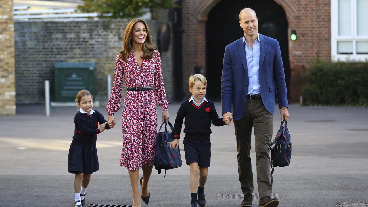 Charlotte held on tight to her mum’s hand as she walked into school for the first time today. Picture: AP.