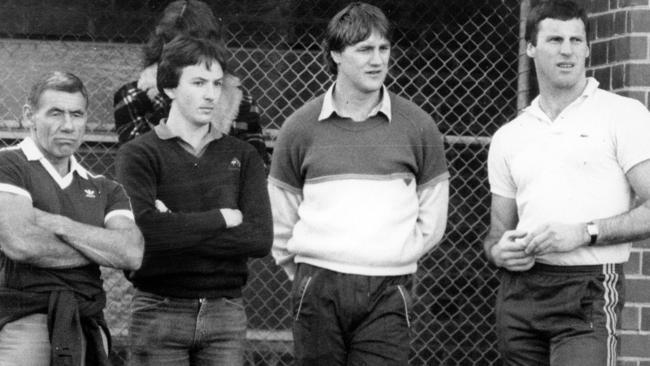 Tom Hafey and Billy Picken watch a training session.