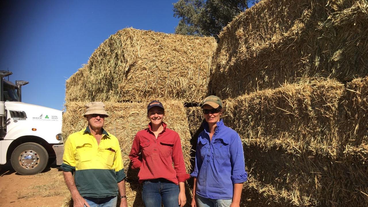 Three generations of farmers collecting Rural Aid bale relief in Yeoval, NSW. From left, Trevor Tremain, granddaughter Darby Tremain and daughter-in-law Nicole Tremain. Picture: supplied