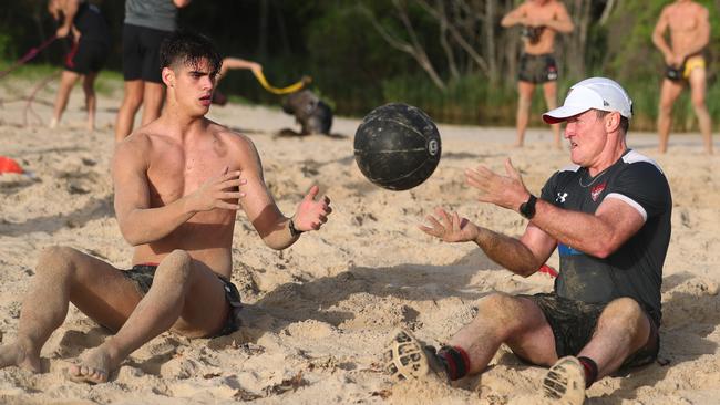 Essendon coach John Worsfold trains with Brandon Zerk-Thatcher, left, during a pre-season training session at Coffs Harbour. Picture: Chris Hyde/AFL Photos