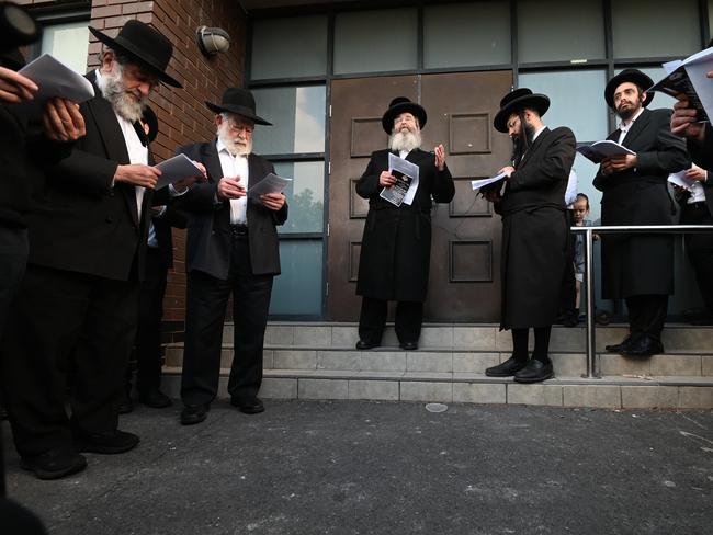 The service was held on the synagogue steps. Picture: Tony Gough