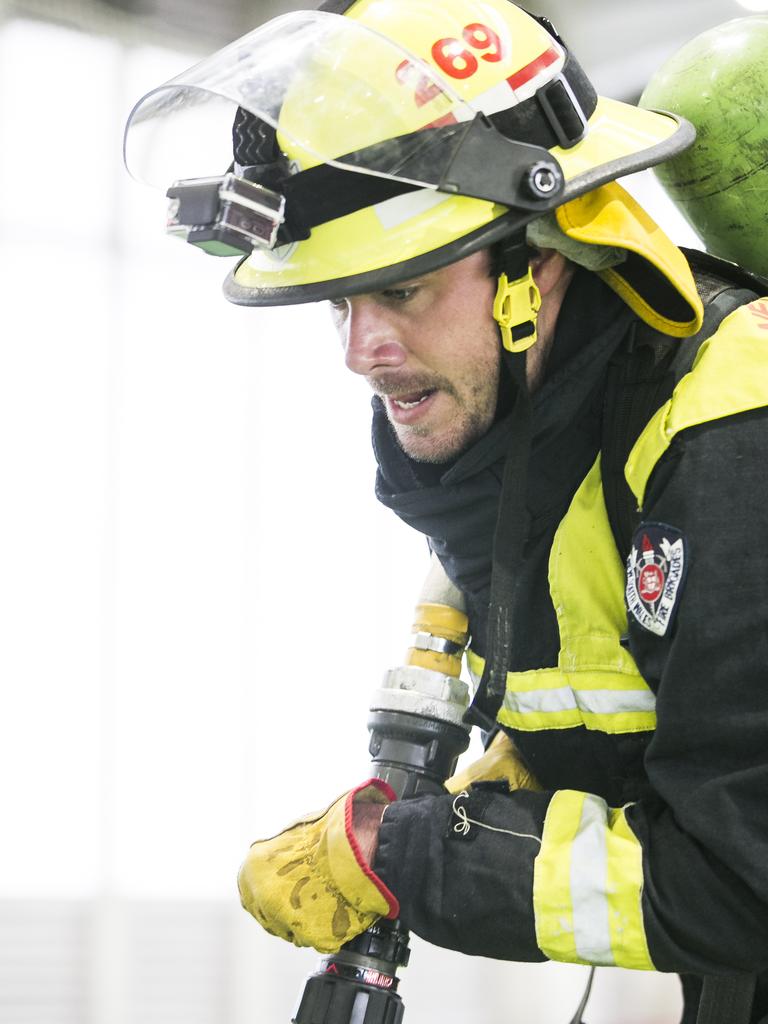 Reporter Jack Morphet takes part in the intense fire training course. Picture: Dylan Robinson