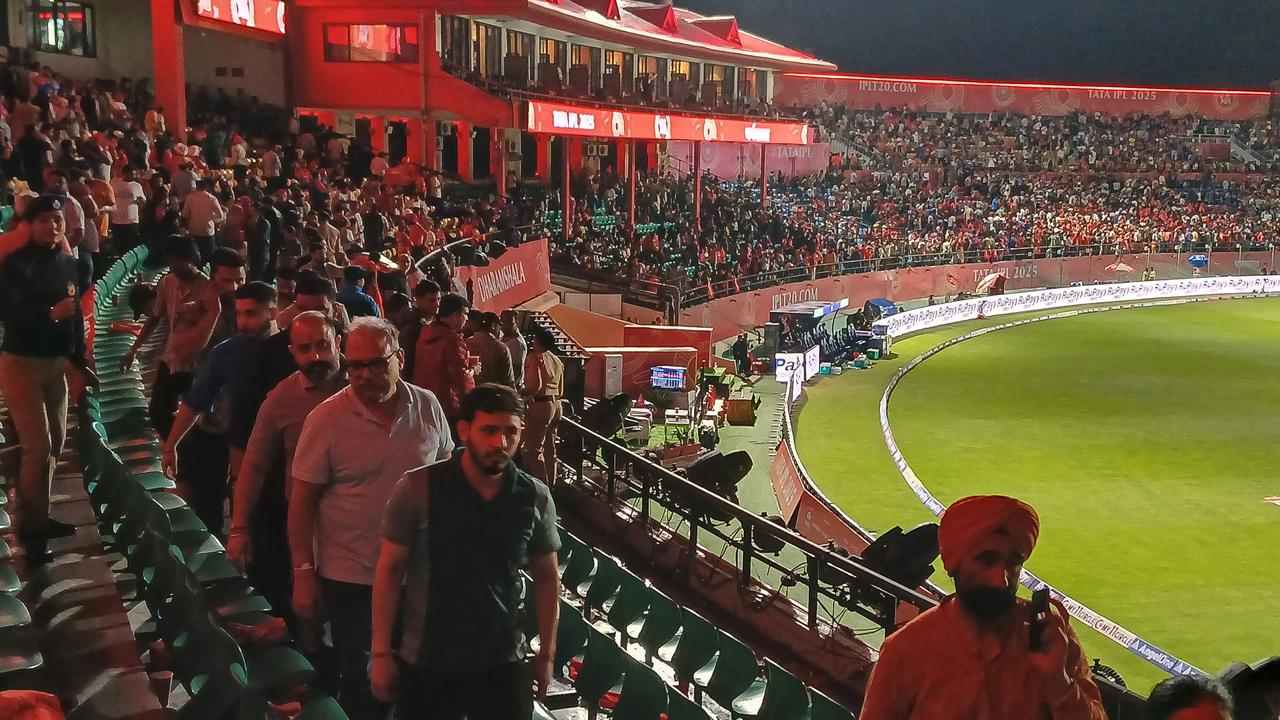 Spectators leave after the Indian Premier League (IPL) Twenty20 cricket match between Punjab Kings and Delhi Capitals was abandoned due to a significant technical failure. (Photo by Shammi MEHRA / AFP)