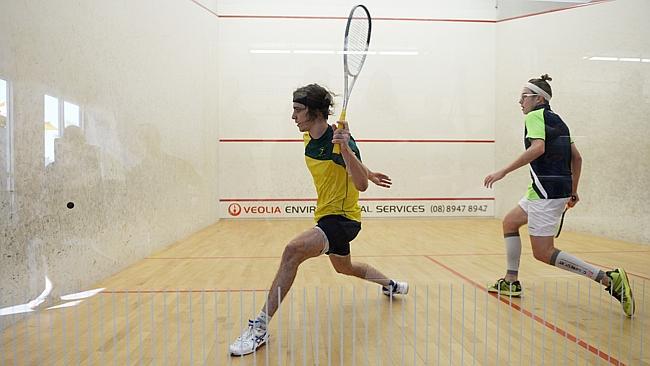 Territory squash star Rhys Dowling winds up during his straight-sets defeat of qualifier Will Curtis in the opening round of the NT Open at Darwin Squash Centre. Picture: IVAN RACHMAN