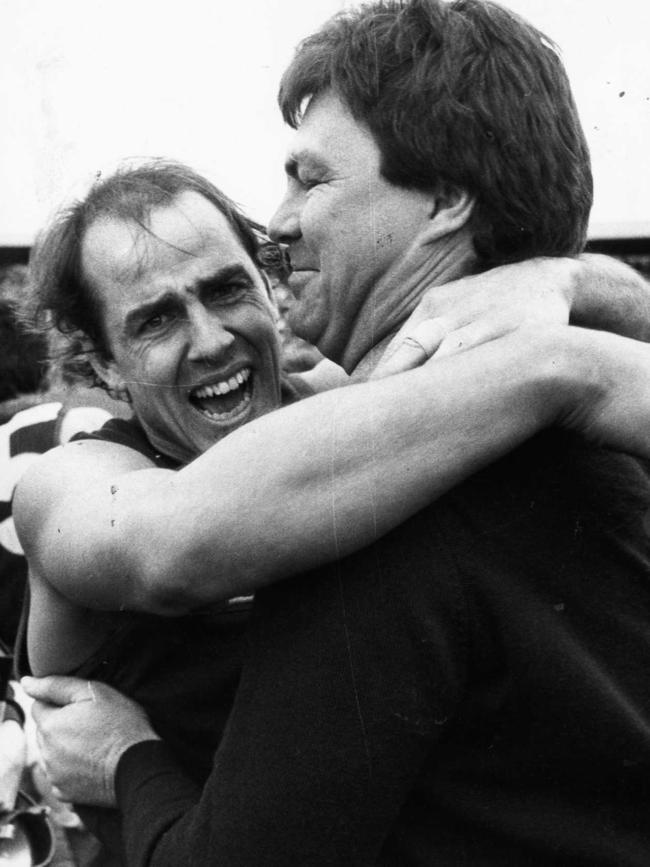 Norwood’s Neville Roberts (left) hugs coach Neil Balme after the final siren.