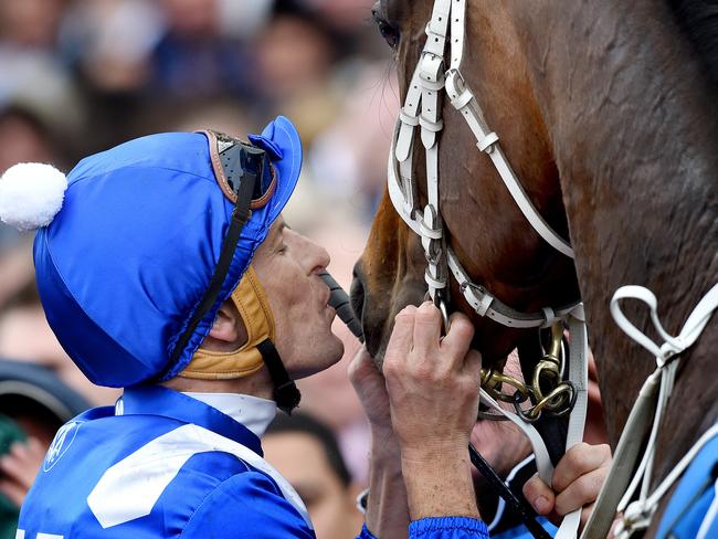 Hugh Bowman gives Winx a kiss after their amazing victory. Picture: Nicole Garmston