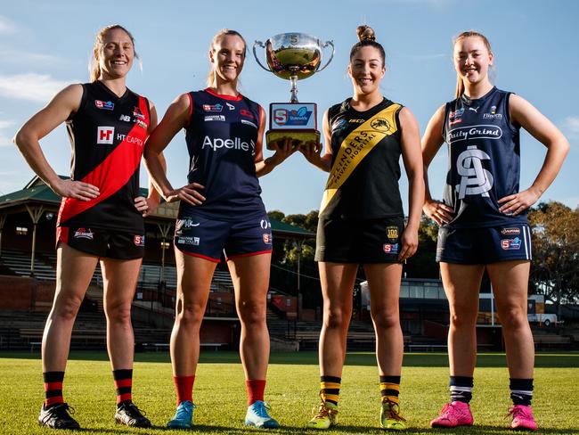 SANFLW players Bec Owen (West Adelaide), Alison Ferrall (Norwood), Ellie Kellock (Glenelg) and Jaslynne Smith (South Adelaide) at Thebarton Oval on May 18, 2021.  The SANFLW finals start this weekend with Norwood taking on Glenelg and West Adelaide playing South Adelaide. Picture Matt Turner.