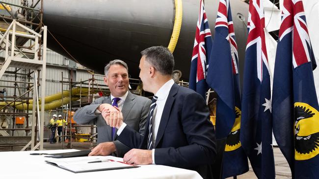 Acting Prime Minister Richard Marles and Premier Peter Malinauskas sign the land agreement to build Australia’s nuclear powered submarines at Osborne shipyard. Picture: NCA NewsWire / Morgan Sette