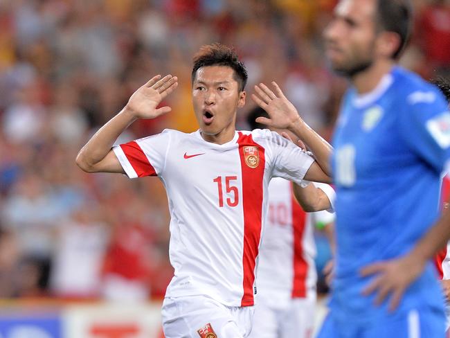 Wu Xi celebrates China’s equaliser.