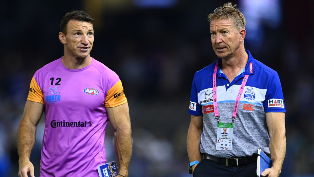 MELBOURNE, AUSTRALIA - APRIL 02: Brent Harvey and Kangaroos head coach David Noble walk off the field after losing the round 3 AFL match between the North Melbourne Kangaroos and the Western Bulldogs at Marvel Stadium on April 02, 2021 in Melbourne, Australia. (Photo by Quinn Rooney/Getty Images)