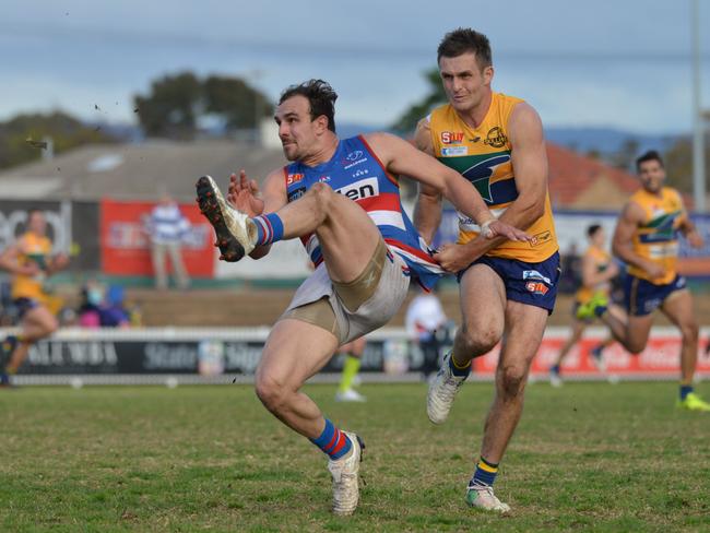 Josh Waldhuter kicks his decisive late goal for Central District against Woodville-West Torrens. Picture: AAP Image/Brenton Edwards