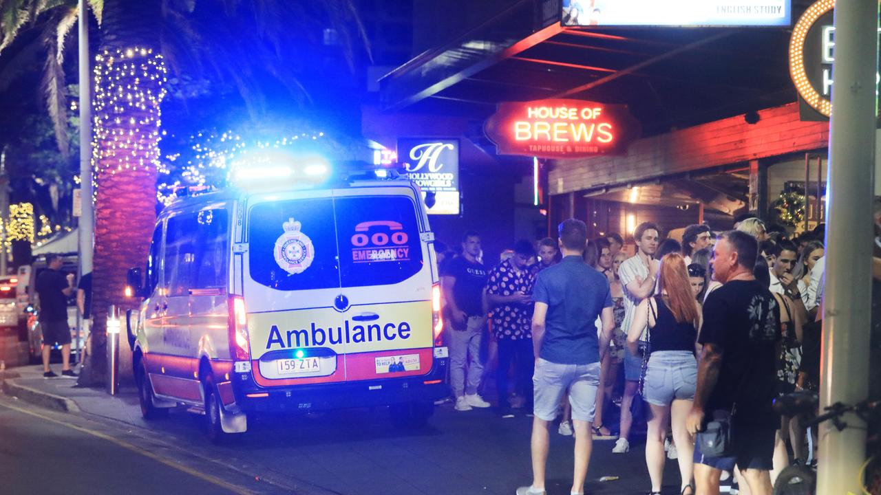 An ambulance crew attends an incident on Surfers Paradise party strip Orchid Avenue.