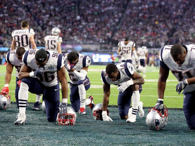 Members of the New England Patriots take a moment prior to kickoff of Super Bowl LII against the Philadelphia Eagles at U.S. Bank Stadium on February 4, 2018 in Minneapolis, Minnesota. Picture: AFP