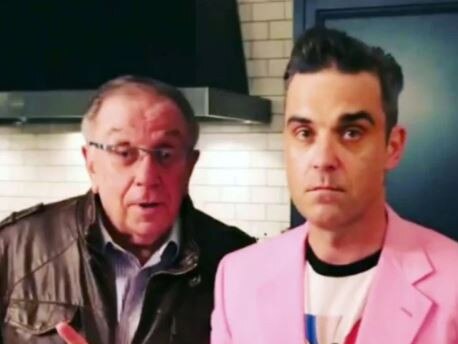 Robbie Williams’ dad Pete Conway has been rushed to hospital after “breaking his spine.”